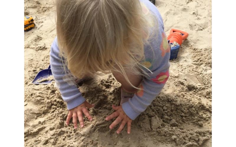 Child playing in sand