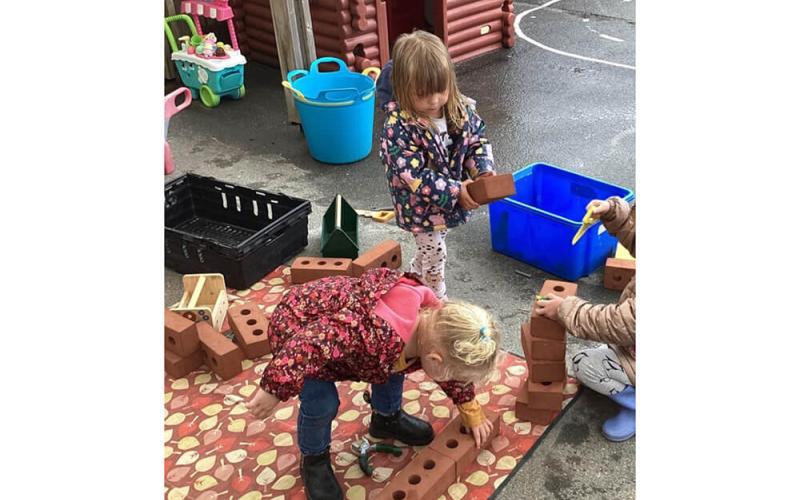 Children playing with bricks